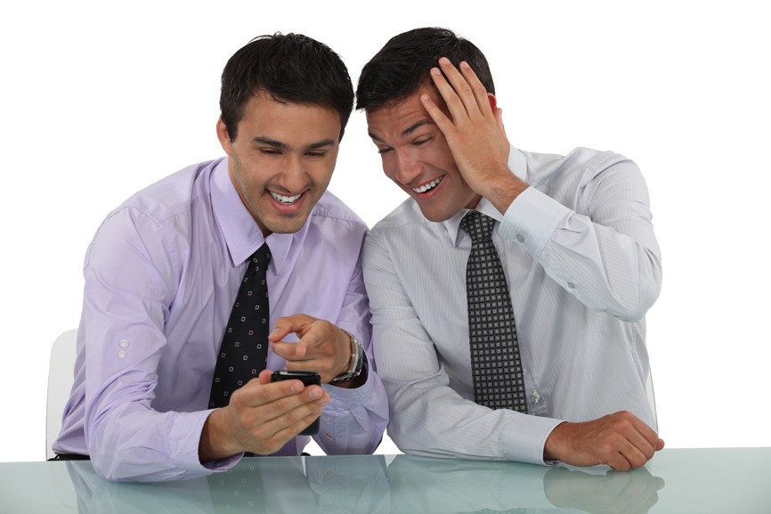 Two businessmen sharing jokes